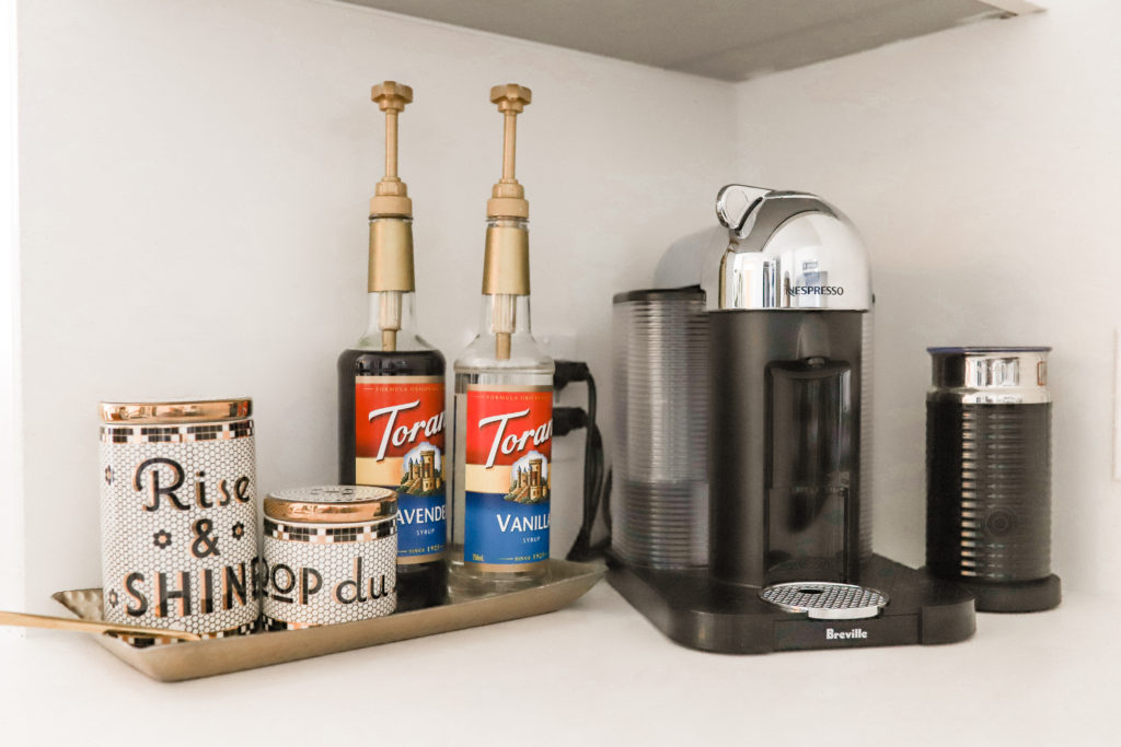 Nespresso machine and coffee syrups.