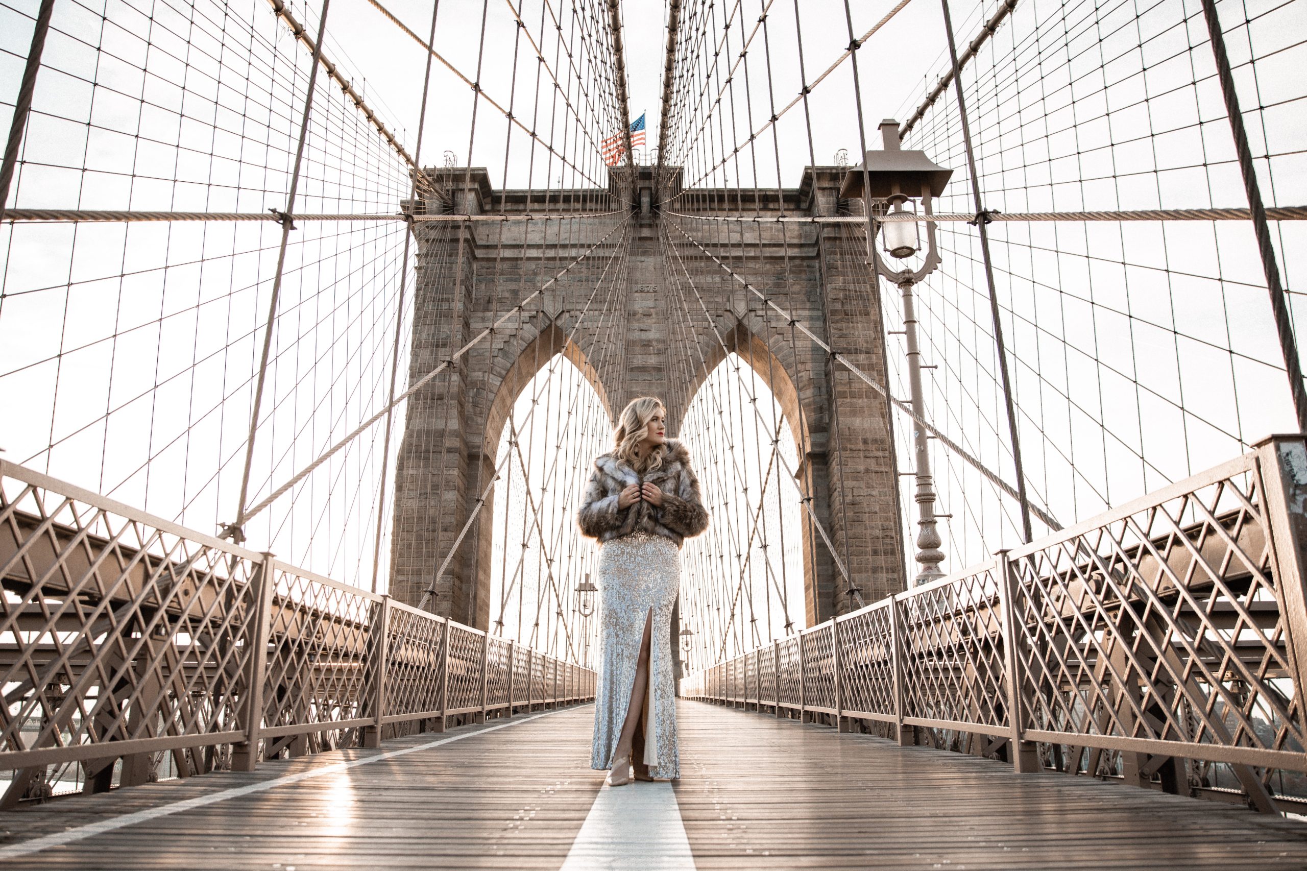 Anna standing on the Brooklyn Bridge.