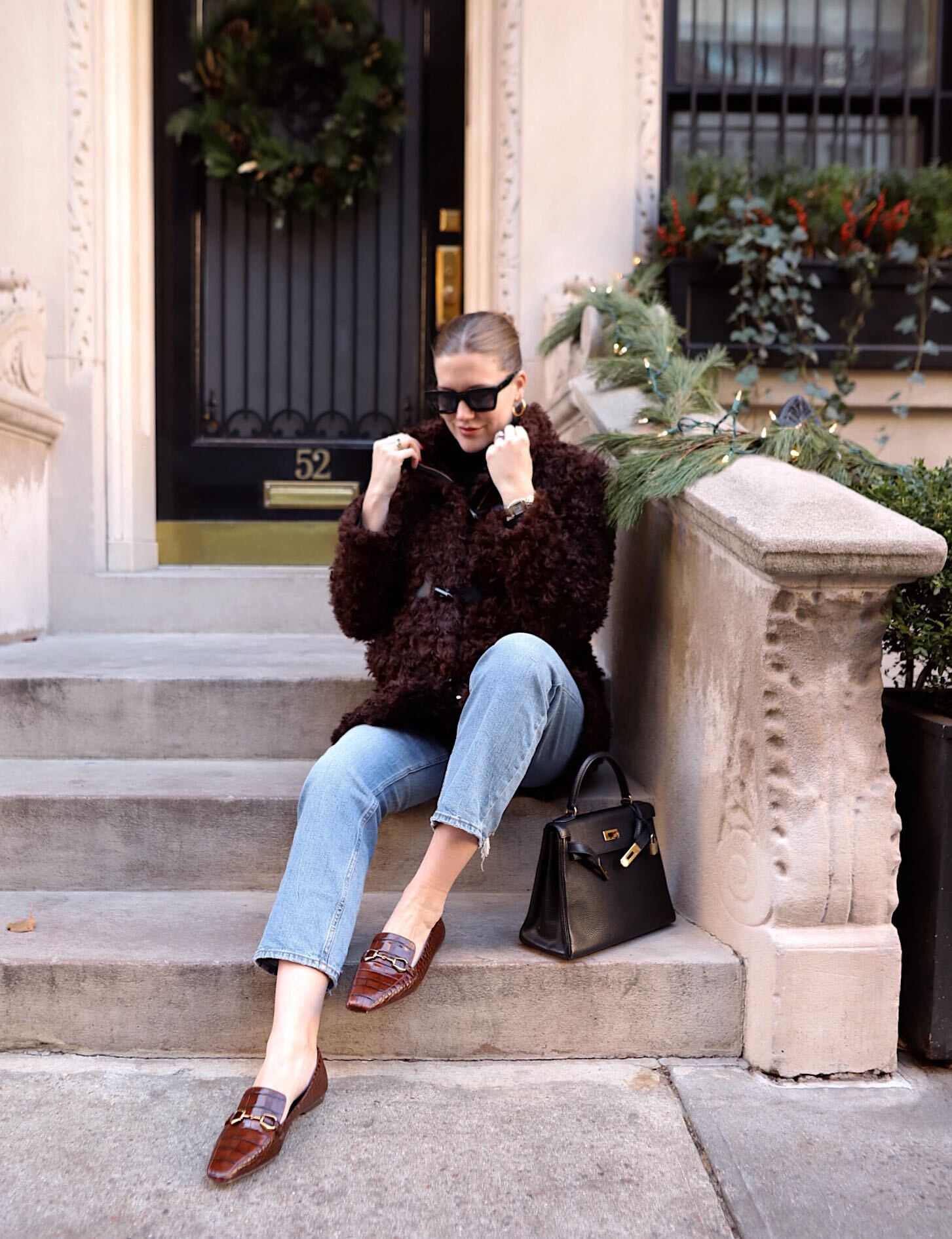 Anna sitting on a NYC stoop and Vince Camuto Loagers