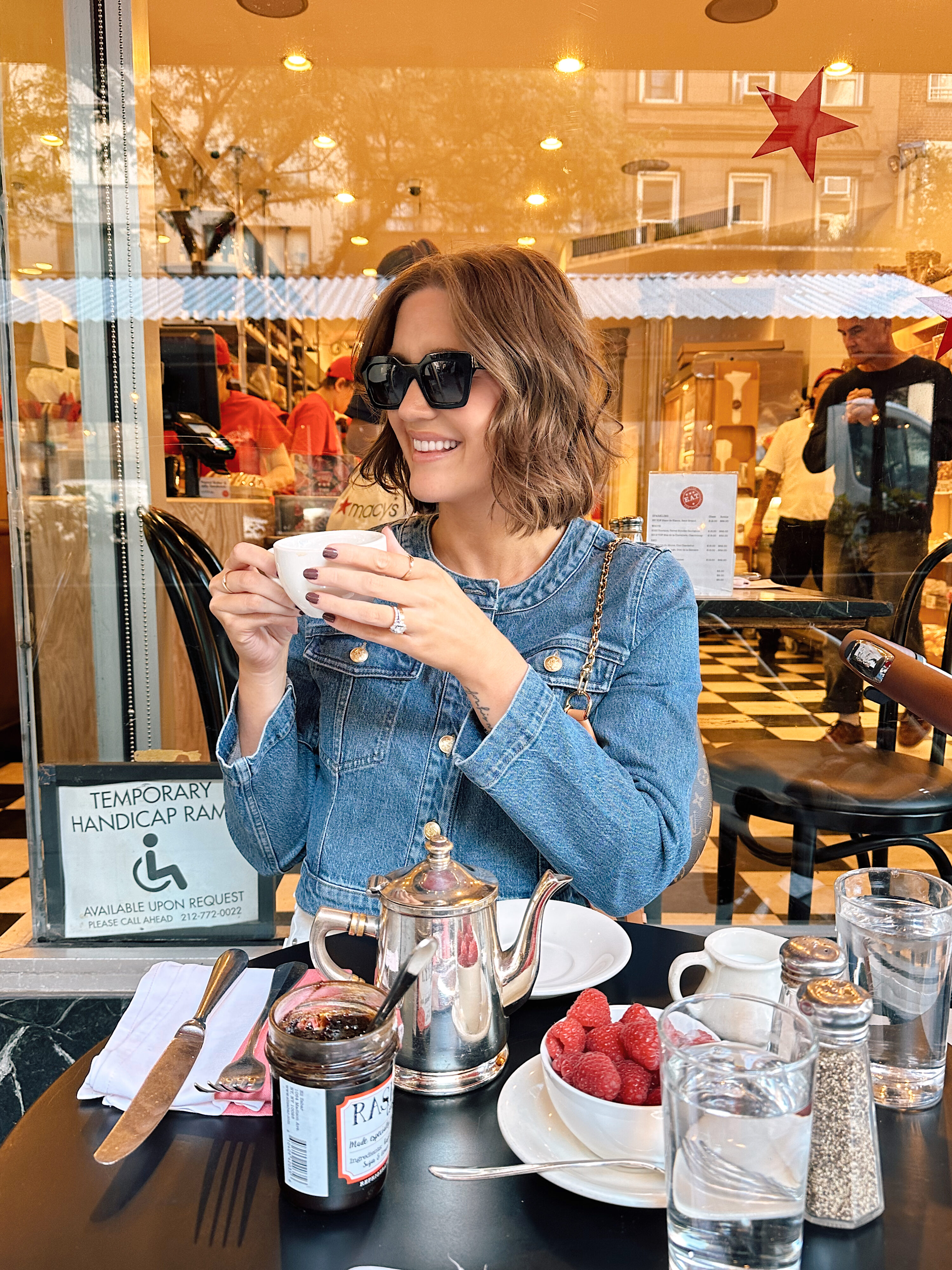 Anna drinking tea at Eli Zabar's restaurant.